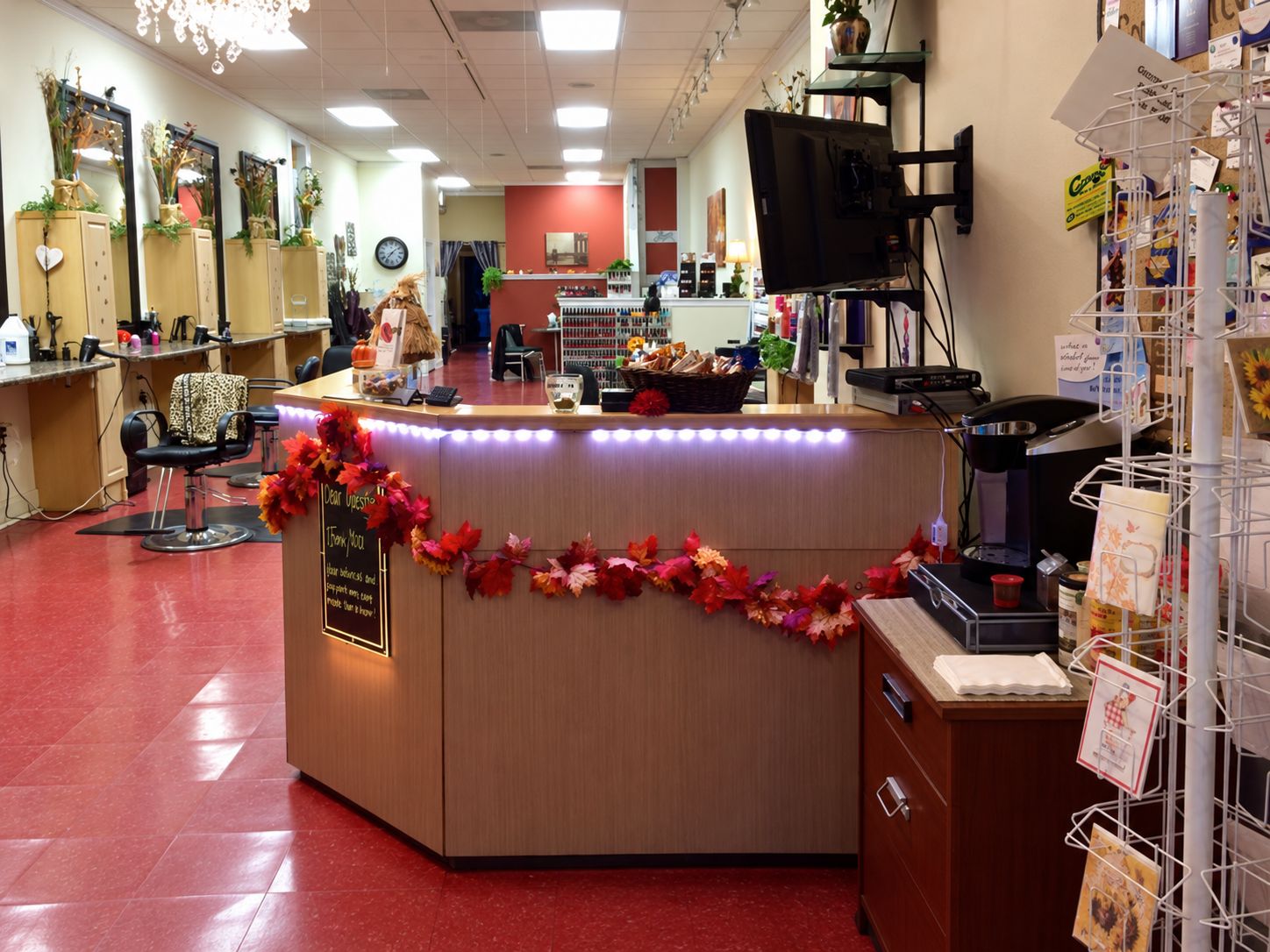 Our front desk looking down the salon toward the styling stations and nail bar