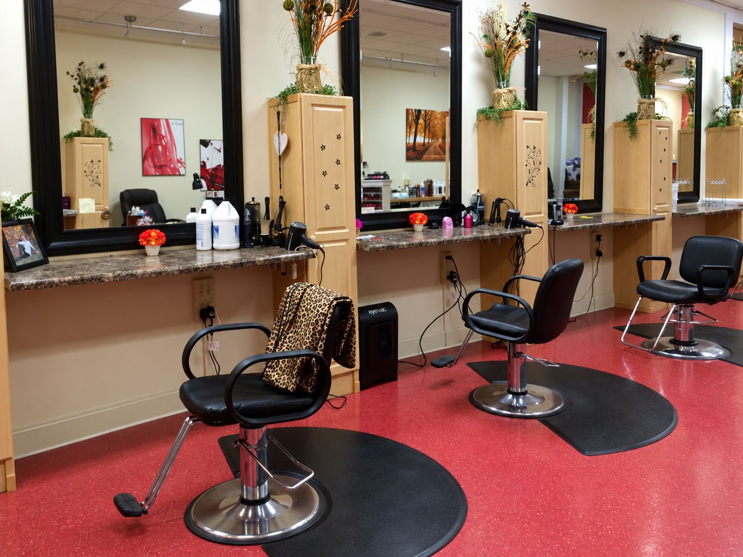 Styling stations with mirrors and chairs