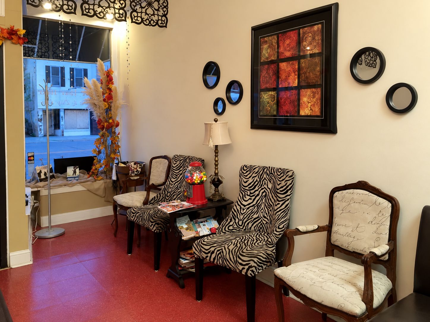 Front window waiting area with zebra print chairs